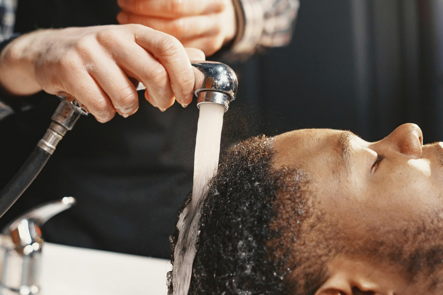 Man getting hair washed in salon